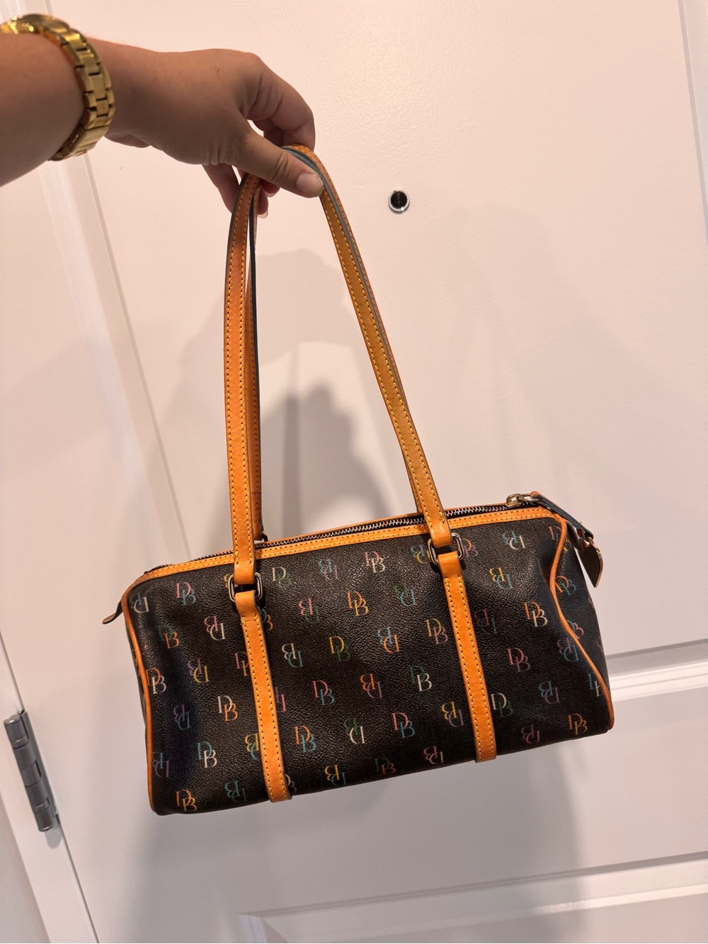 Vintage Dooney & Bourke rainbow brown and tan barrel bag with charm